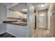 Cozy kitchen with white cabinets, countertops, tile floors, and modern appliances at 3555 Highway 544 # 4-C, Conway, SC 29526