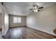 Open living room with hardwood floors, ceiling fan, and natural light from window at 3555 Highway 544 # 4-C, Conway, SC 29526