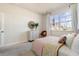 Comfortable bedroom featuring large windows, modern decor, and soft carpeted floors at 399 Wingspan Ct., Myrtle Beach, SC 29588