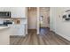 Stylish kitchen featuring wood floors, white cabinets and natural lighting at 399 Wingspan Ct., Myrtle Beach, SC 29588