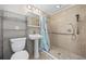 Bathroom features a stand up shower with grab bar, single sink and commode at 401 25Th Ave. S, North Myrtle Beach, SC 29582
