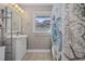 Bathroom with a nautical-themed shower curtain and window view at 401 25Th Ave. S, North Myrtle Beach, SC 29582