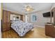 Bedroom featuring built-in cabinets, hardwood floors, and ceiling fan at 401 25Th Ave. S, North Myrtle Beach, SC 29582
