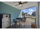 Charming covered patio featuring comfortable seating, a ceiling fan, and a glimpse of the nearby beach at 401 25Th Ave. S, North Myrtle Beach, SC 29582
