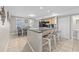 Kitchen island with seating overlooking breakfast area and kitchen featuring stainless steel appliances at 401 25Th Ave. S, North Myrtle Beach, SC 29582