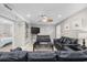 Inviting living room featuring sleek furniture, ceiling fan, mounted TV, and access to other rooms at 401 25Th Ave. S, North Myrtle Beach, SC 29582