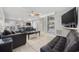 Well-lit living room with hardwood floors, ceiling fan, comfortable seating, and open layout at 401 25Th Ave. S, North Myrtle Beach, SC 29582