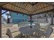 Beautiful pool area under a gazebo with a view of the pool and nearby buildings at 401 25Th Ave. S, North Myrtle Beach, SC 29582