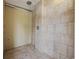 Shower featuring beige tiles with a chrome showerhead and faucet at 401 25Th Ave. S, North Myrtle Beach, SC 29582