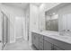Bathroom with a double sink vanity, quartz countertop, and a glass-enclosed shower at 4295 Falls Oaks St., Myrtle Beach, SC 29579