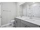Bright bathroom features double sink vanity with gray cabinetry and tile flooring at 4295 Falls Oaks St., Myrtle Beach, SC 29579