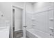 Clean bathroom with white tub and shower and door to another room at 4295 Falls Oaks St., Myrtle Beach, SC 29579