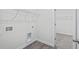 Neutral laundry room with washer/dryer hookups and vinyl plank flooring at 4295 Falls Oaks St., Myrtle Beach, SC 29579