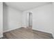 Large empty living room featuring wood floors, neutral paint and base trim at 4295 Falls Oaks St., Myrtle Beach, SC 29579