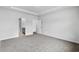 Large bedroom with carpet flooring and doorway view to ensuite bathroom at 4295 Falls Oaks St., Myrtle Beach, SC 29579