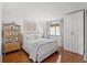 Charming bedroom with hardwood floors, comfortable bed, and natural light creating a cozy and inviting space at 4440 Nassau Ct. # D-507, Little River, SC 29566