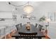 Dining room with modern chandelier, seating for six, and stylish accents at 4440 Nassau Ct. # D-507, Little River, SC 29566