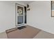 Inviting unit entrance featuring a welcome mat and charming decor at 4440 Nassau Ct. # D-507, Little River, SC 29566
