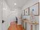 Charming hallway featuring hardwood floors and elegant seashell decor at 4440 Nassau Ct. # D-507, Little River, SC 29566