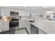 Gorgeous updated kitchen with stainless steel appliances and quartz countertops at 4440 Nassau Ct. # D-507, Little River, SC 29566