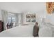 Tranquil bedroom with balcony access, comfortable bed, and natural light creating a relaxing atmosphere at 4440 Nassau Ct. # D-507, Little River, SC 29566