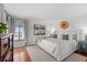 Bright bedroom showcasing a comfortable bed, hardwood floors, and ample natural light for a peaceful ambiance at 4440 Nassau Ct. # D-507, Little River, SC 29566