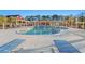 Pool area with lounge chairs, a well-maintained pool, and a view of nearby condo buildings at 4440 Nassau Ct. # D-507, Little River, SC 29566