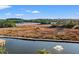 Scenic waterfront view with a lighthouse, marshland, and a tranquil waterway with a fountain at 4440 Nassau Ct. # D-507, Little River, SC 29566
