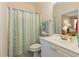 Bathroom with shower, vanity, toilet and tub featuring a striped shower curtain at 4503 W Harbour Ct. # S-6, Little River, SC 29566