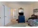 Bright bedroom with a blue dresser and a doorway to another room at 4503 W Harbour Ct. # S-6, Little River, SC 29566
