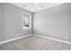 This bedroom features a ceiling fan and a window to allow plenty of light in at 4503 W Harbour Ct. # S-6, Little River, SC 29566
