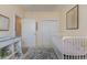 Bedroom features a white crib, changing table, neutral walls and patterned area rug at 4503 W Harbour Ct. # S-6, Little River, SC 29566