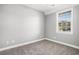 This bedroom features a ceiling fan and a window to allow plenty of light in at 4503 W Harbour Ct. # S-6, Little River, SC 29566