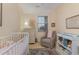 Charming Bedroom with a crib, changing table, and a cozy rocking chair at 4503 W Harbour Ct. # S-6, Little River, SC 29566