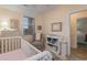 Well-decorated Bedroom with a crib, changing table, and a comfortable rocking chair at 4503 W Harbour Ct. # S-6, Little River, SC 29566