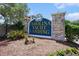Carolina Yacht Landing sign featuring a blue and gold color scheme, brick pillars, and manicured landscaping at 4503 W Harbour Ct. # S-6, Little River, SC 29566