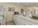 Bright kitchen featuring white cabinets, sink, and views into living space at 4503 W Harbour Ct. # S-6, Little River, SC 29566