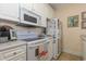 Kitchen area has white appliances, countertop and drawers at 4503 W Harbour Ct. # S-6, Little River, SC 29566