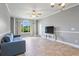 Bright living room with ceiling fan, tile flooring, and large window views at 4503 W Harbour Ct. # S-6, Little River, SC 29566