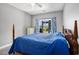 Main bedroom featuring view to yard, natural light and blue patterned curtains at 4503 W Harbour Ct. # S-6, Little River, SC 29566