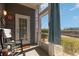 Charming patio with rocking chair overlooking the yard and pond at 4503 W Harbour Ct. # S-6, Little River, SC 29566