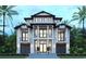 Stunning three-story home featuring a sleek modern design with meticulously landscaped grounds and a grand entrance at 4710 Surf St., North Myrtle Beach, SC 29582