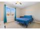 Bedroom with a ceiling fan, neutral carpet and walls, and window with blue curtains at 500 Willow Greens Dr. # 500-G, Conway, SC 29526