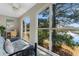Bedroom featuring an arched window with view of a pond and a ceiling fan at 500 Willow Greens Dr. # 500-G, Conway, SC 29526