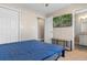 Bedroom featuring a tv, bench, and ensuite bathroom at 500 Willow Greens Dr. # 500-G, Conway, SC 29526