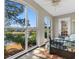Bedroom featuring an arched window with view of a pond and a ceiling fan at 500 Willow Greens Dr. # 500-G, Conway, SC 29526