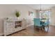 The dining room features modern decor, stylish furniture, and plenty of natural light at 500 Willow Greens Dr. # 500-G, Conway, SC 29526