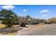 Brick apartment building with well-manicured landscaping and plenty of parking on a sunny day with scattered clouds at 500 Willow Greens Dr. # 500-G, Conway, SC 29526