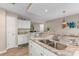 Well-lit kitchen featuring stainless steel appliances, granite countertops, and a view into an adjacent living space at 500 Willow Greens Dr. # 500-G, Conway, SC 29526