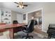 The office boasts a large desk, ceiling fan, and natural light at 500 Willow Greens Dr. # 500-G, Conway, SC 29526